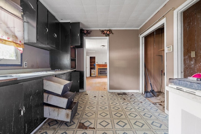 2727 Old Tilton Rd, Dalton, GA 30721 - kitchen with dark cabinets, light flooring, and ornamental molding