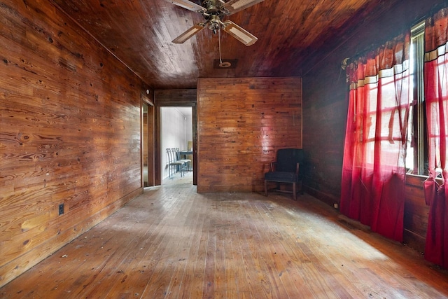 2727 Old Tilton Rd, Dalton, GA 30721 - unfurnished living room featuring wood ceiling, a ceiling fan, wooden walls, and hardwood / wood-style floors