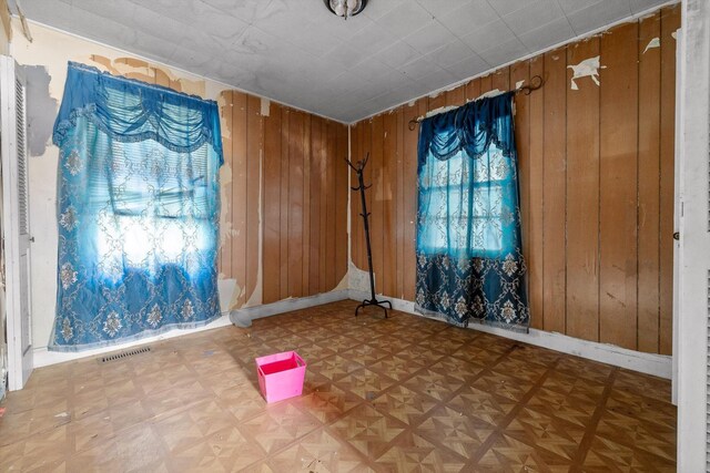 2727 Old Tilton Rd, Dalton, GA 30721 - empty room featuring wooden walls and plenty of natural light