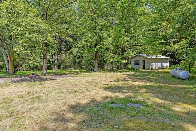 2727 Old Tilton Rd, Dalton, GA 30721 - view of green lawn featuring a view of trees and an outdoor structure