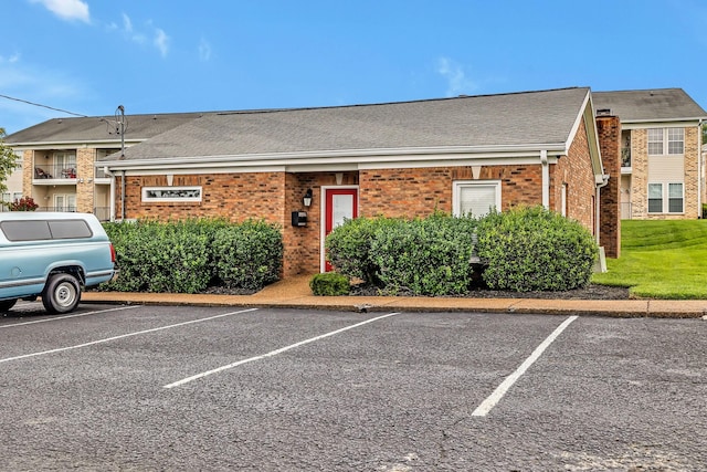 411 Churchill Xing, Madison, TN 37115 - view of front of home featuring uncovered parking, brick siding, and a shingled roof