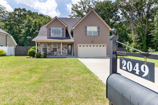 2049 Hackensack Ln, Smyrna, TN 37167 - view of front of home featuring a garage, driveway, covered porch, and stone siding