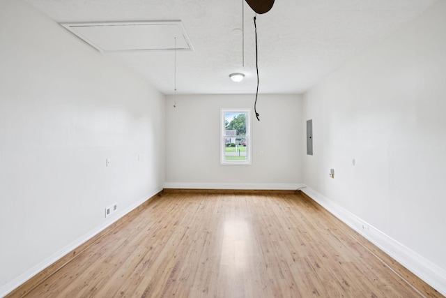 111 Platte Dr, Christiana, TN 37037 - empty room with attic access, electric panel, and light wood-type flooring