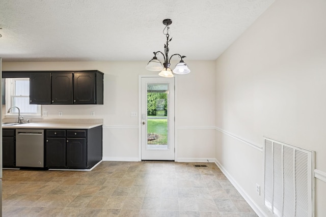 111 Platte Dr, Christiana, TN 37037 - kitchen featuring dishwasher, healthy amount of natural light, light countertops, a textured ceiling, and a chandelier