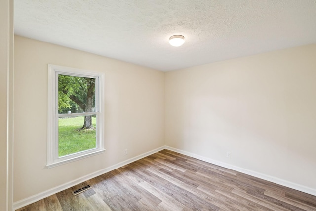 111 Platte Dr, Christiana, TN 37037 - empty room featuring wood finished floors and a textured ceiling