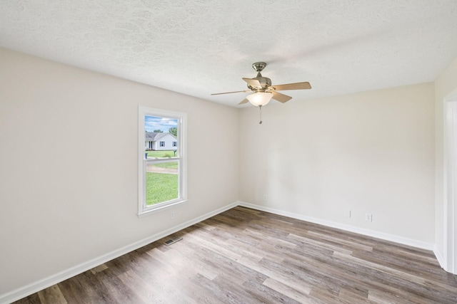 111 Platte Dr, Christiana, TN 37037 - spare room with wood finished floors, ceiling fan, and a textured ceiling