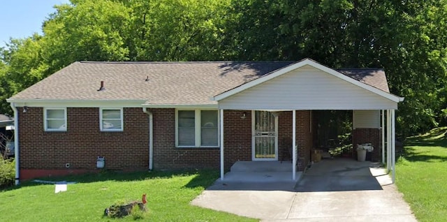 936 34th Ave N, Nashville, TN 37209 - view of front of house with brick siding, concrete driveway, a carport, a front lawn, and a shingled roof