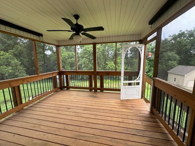 1248 Rich Ellen Dr, Palmyra, TN 37142 - wooden deck featuring a sunroom and ceiling fan