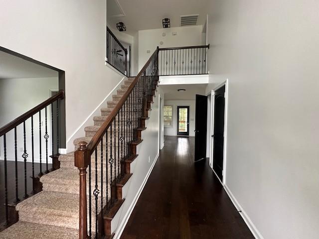 1248 Rich Ellen Dr, Palmyra, TN 37142 - stairway featuring wood finished floors and a high ceiling