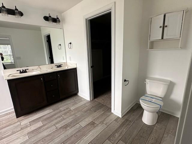 1248 Rich Ellen Dr, Palmyra, TN 37142 - bathroom featuring wood finished floors and double vanity
