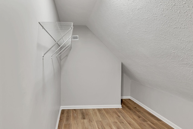 905 Septo Ct, Antioch, TN 37013 - walk in closet featuring vaulted ceiling and wood finished floors