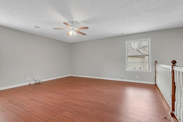 905 Septo Ct, Antioch, TN 37013 - unfurnished room featuring ceiling fan, wood finished floors, and a textured ceiling