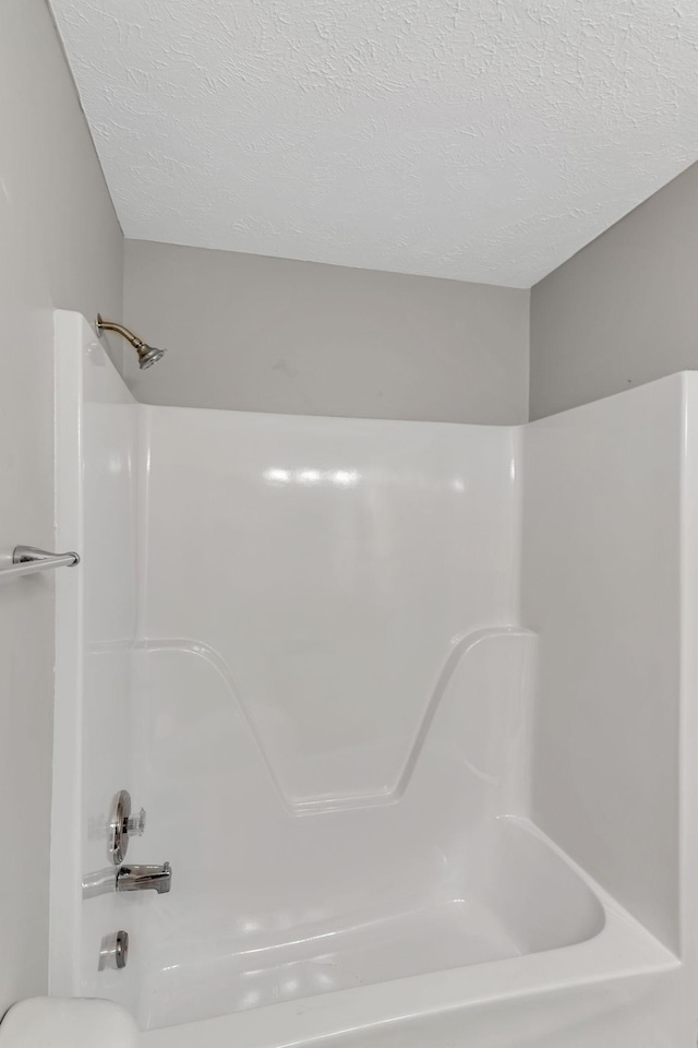 905 Septo Ct, Antioch, TN 37013 - bathroom with a textured ceiling and shower / bathtub combination