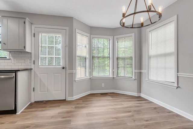 905 Septo Ct, Antioch, TN 37013 - unfurnished dining area featuring a chandelier, healthy amount of natural light, and light wood-style flooring