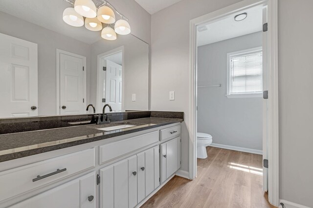 905 Septo Ct, Antioch, TN 37013 - bathroom with a chandelier, vanity, and wood finished floors