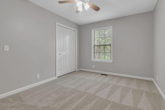 905 Septo Ct, Antioch, TN 37013 - unfurnished bedroom with carpet, a closet, and ceiling fan