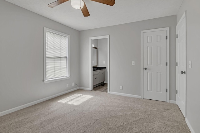 905 Septo Ct, Antioch, TN 37013 - unfurnished bedroom with light carpet, ensuite bath, and ceiling fan