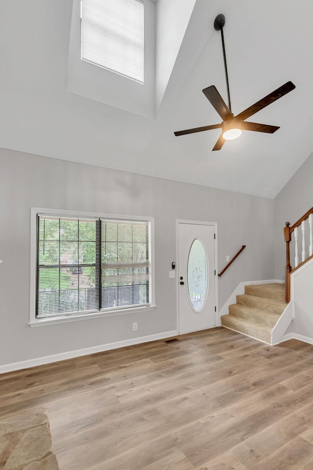 905 Septo Ct, Antioch, TN 37013 - foyer with ceiling fan, stairway, healthy amount of natural light, high vaulted ceiling, and light wood finished floors