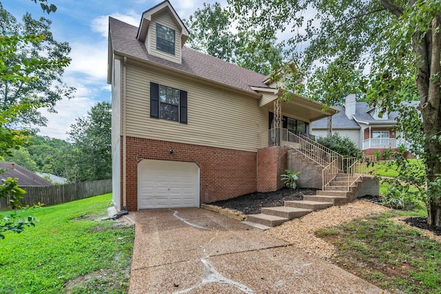 905 Septo Ct, Antioch, TN 37013 - view of front facade featuring an attached garage, driveway, a shingled roof, and brick siding
