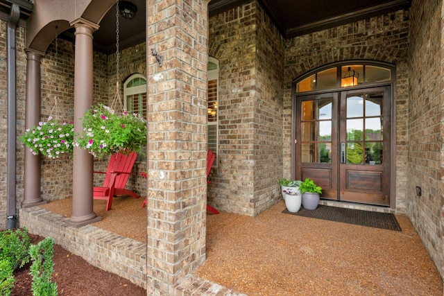 1794 Balvenie Ct, Brentwood, TN 37027 - property entrance with french doors, brick siding, and covered porch