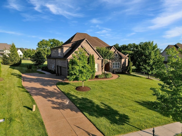 1794 Balvenie Ct, Brentwood, TN 37027 - view of front of house featuring an attached garage, stone siding, concrete driveway, and a front lawn