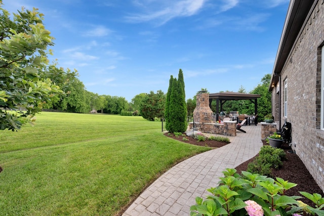 1794 Balvenie Ct, Brentwood, TN 37027 - view of grassy yard with exterior fireplace and a patio