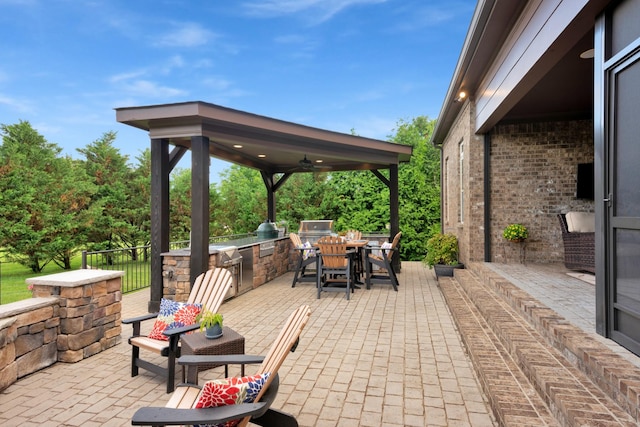1794 Balvenie Ct, Brentwood, TN 37027 - view of patio with an outdoor kitchen, a ceiling fan, a gazebo, and outdoor dining area