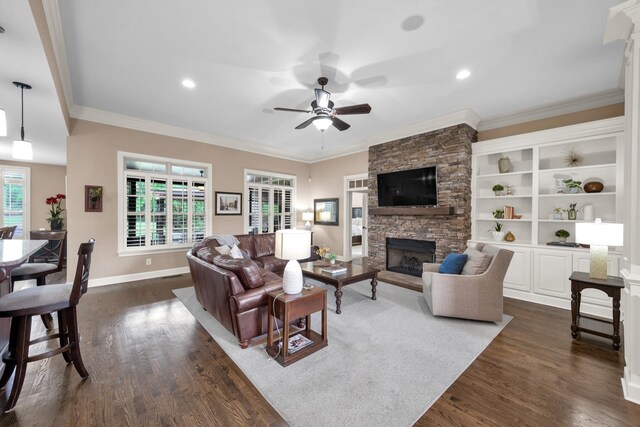 1794 Balvenie Ct, Brentwood, TN 37027 - living room with a fireplace, crown molding, a ceiling fan, dark wood-type flooring, and recessed lighting