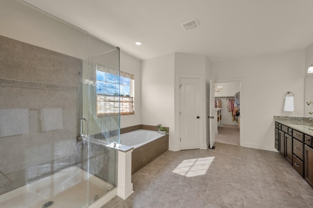 1794 Balvenie Ct, Brentwood, TN 37027 - bathroom with vanity, a bath, a shower stall, a walk in closet, and recessed lighting