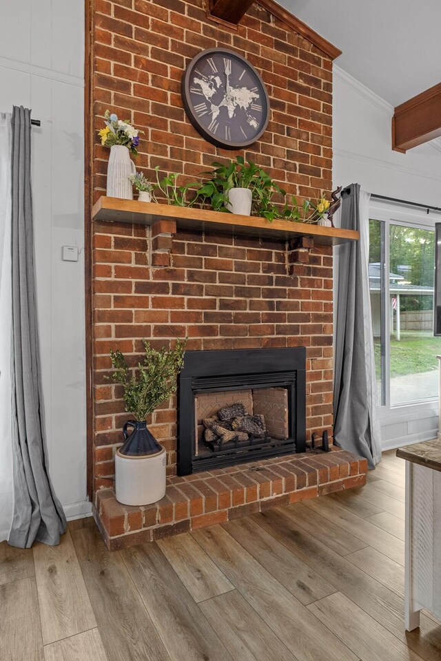 5920 Dogwood Dr, Harrison, TN 37341 - detailed view of crown molding, wood finished floors, and a fireplace
