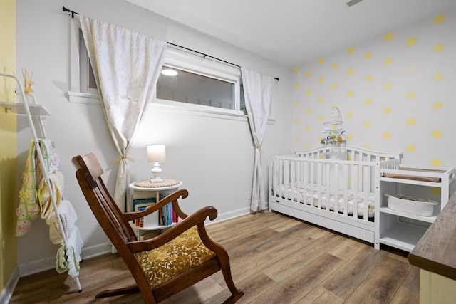 5920 Dogwood Dr, Harrison, TN 37341 - bedroom featuring wallpapered walls and wood finished floors