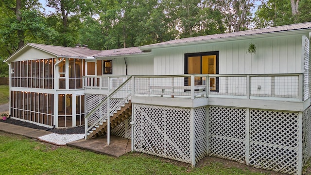 5920 Dogwood Dr, Harrison, TN 37341 - back of property with a sunroom, stairs, a metal roof, and a wooden deck