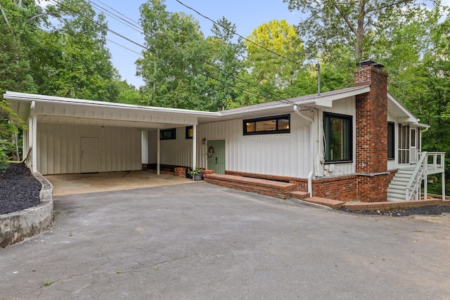 5920 Dogwood Dr, Harrison, TN 37341 - view of front of home with driveway and a chimney