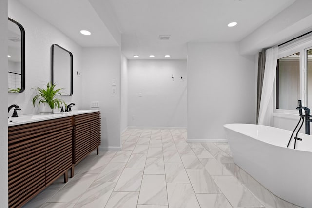 5920 Dogwood Dr, Harrison, TN 37341 - full bath with a freestanding bath, double vanity, recessed lighting, and marble look tiles