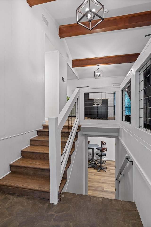 5920 Dogwood Dr, Harrison, TN 37341 - staircase featuring a chandelier and beam ceiling