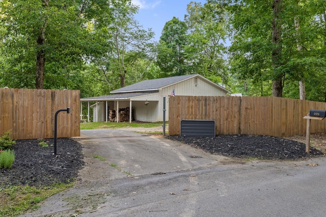 5920 Dogwood Dr, Harrison, TN 37341 - garage featuring a carport and asphalt driveway