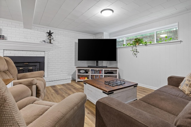 5920 Dogwood Dr, Harrison, TN 37341 - living area with light wood-type flooring, a brick fireplace, and brick wall