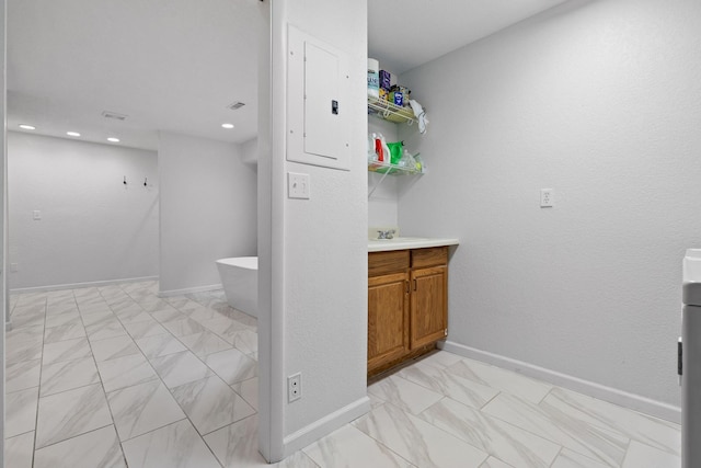 5920 Dogwood Dr, Harrison, TN 37341 - laundry room featuring light marble finish floors and recessed lighting