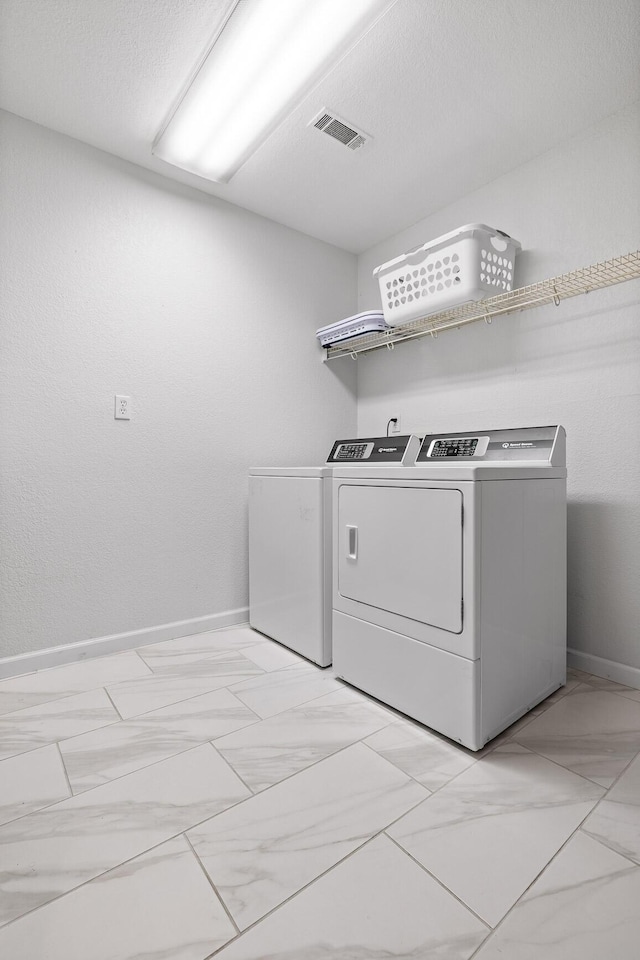 5920 Dogwood Dr, Harrison, TN 37341 - laundry area with independent washer and dryer and light marble finish floors