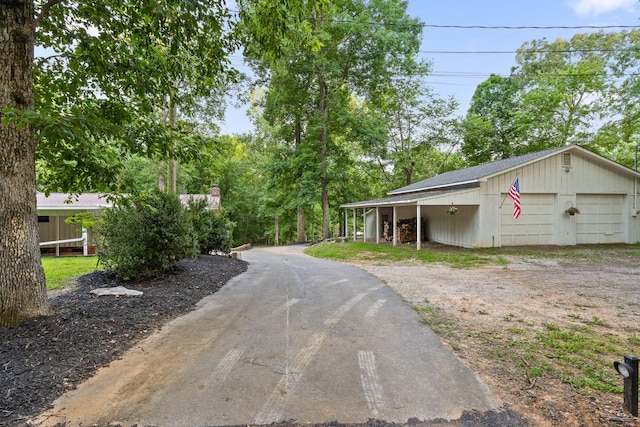5920 Dogwood Dr, Harrison, TN 37341 - view of yard featuring a detached garage and driveway