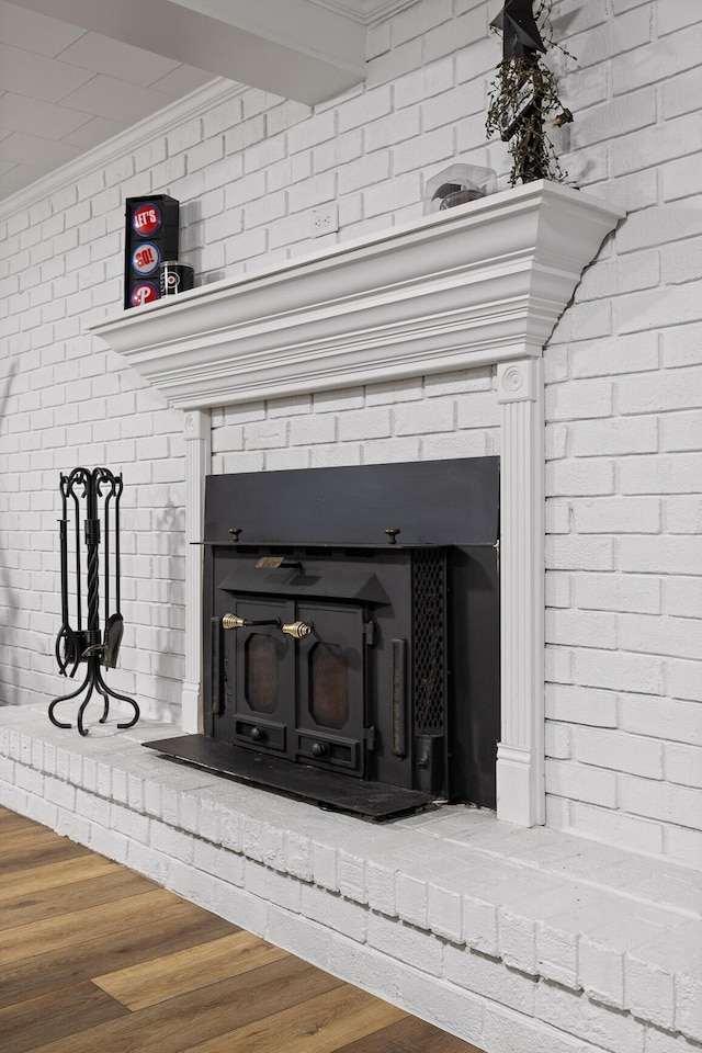 5920 Dogwood Dr, Harrison, TN 37341 - detailed view of ornamental molding, a brick fireplace, and wood finished floors