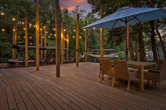 5920 Dogwood Dr, Harrison, TN 37341 - deck at dusk featuring outdoor dining space
