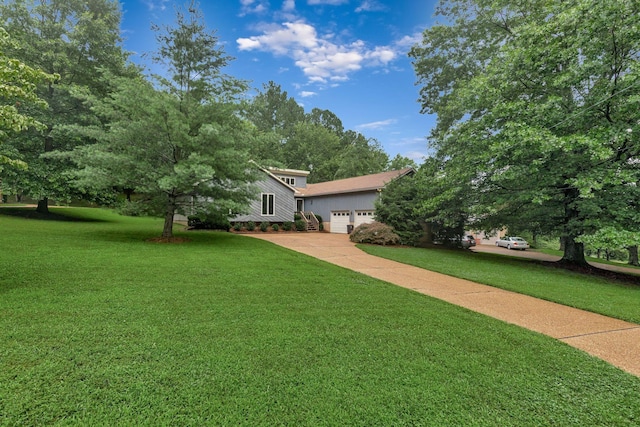 5122 Prince Phillip Cv, Brentwood, TN 37027 - view of grassy yard featuring an attached garage and driveway