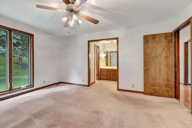 5122 Prince Phillip Cv, Brentwood, TN 37027 - unfurnished bedroom with multiple windows, carpet floors, a ceiling fan, and ensuite bathroom