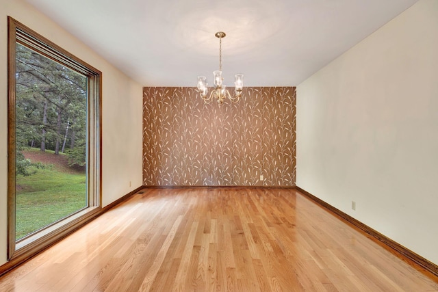 5122 Prince Phillip Cv, Brentwood, TN 37027 - spare room featuring a chandelier and light wood-style floors