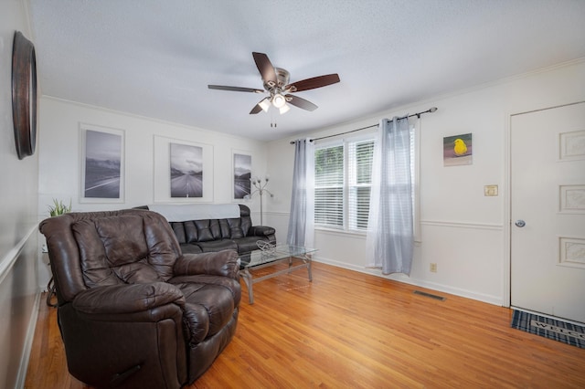 332 Old Dunbar Cave Rd, Clarksville, TN 37043 - living room featuring ceiling fan, light wood finished floors, and ornamental molding