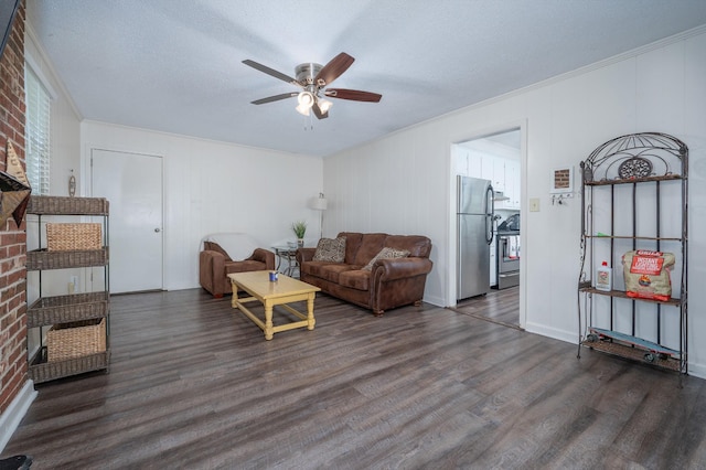 332 Old Dunbar Cave Rd, Clarksville, TN 37043 - living room featuring dark wood finished floors, ceiling fan, crown molding, and a textured ceiling
