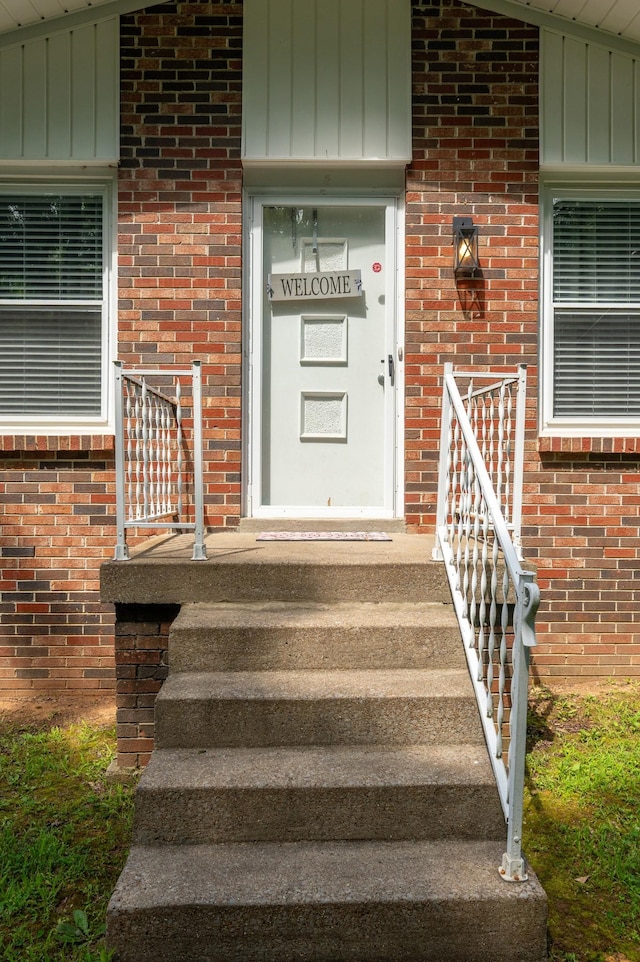 332 Old Dunbar Cave Rd, Clarksville, TN 37043 - view of exterior entry with board and batten siding and brick siding