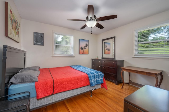 332 Old Dunbar Cave Rd, Clarksville, TN 37043 - bedroom with multiple windows, light wood finished floors, and a ceiling fan