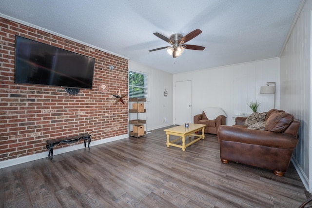 332 Old Dunbar Cave Rd, Clarksville, TN 37043 - living area with wood finished floors, ceiling fan, brick wall, and a textured ceiling